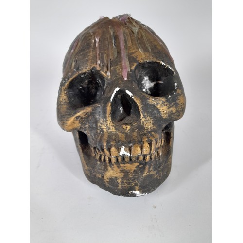 76 - Plaster Skull with dripping wax, bronze painted, 15cm x 20cm