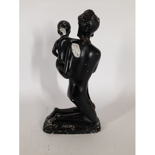 77 - Blackamoor lady with child figure, 31cm high