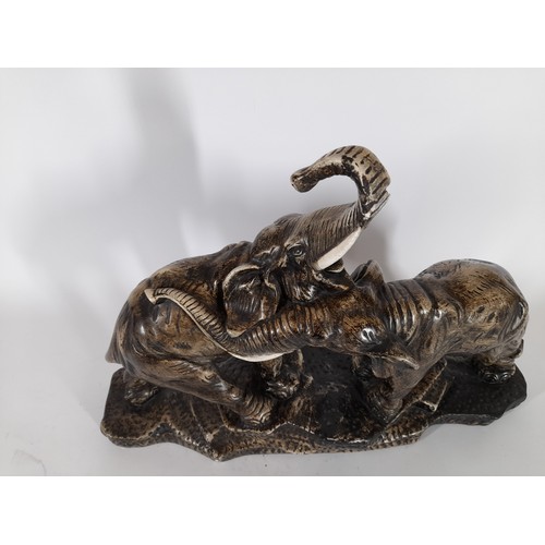 93 - Large ceramic display of 2 elephants tail broken on one and chip to trunk on the other. 36cm x 50cm