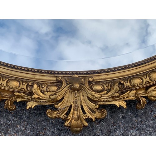 35 - Large Vintage Oval Gilt Decorated Mirror. 114 x 114 cms