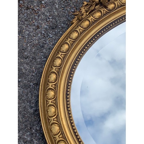 35 - Large Vintage Oval Gilt Decorated Mirror. 114 x 114 cms