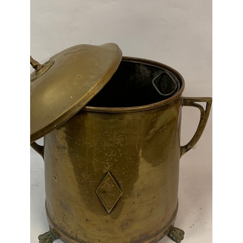 49 - Antique Brass Coal Bin With Lion Paw Feet Along With Internal Liner And A Decorative Finial.