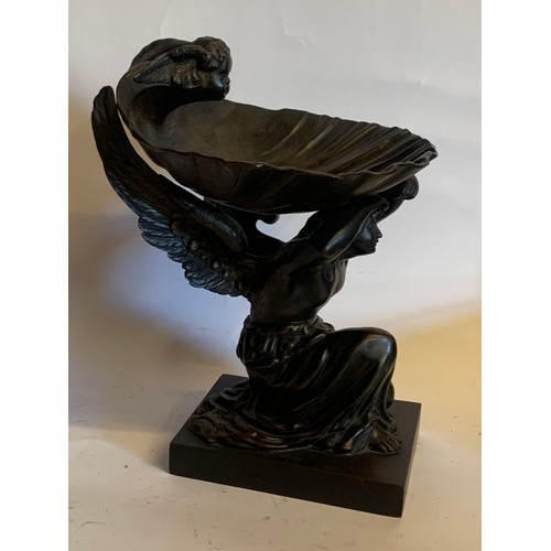 220 - Bronze Figure Of A kneeling Woman Holding A Shell Above With A Cherub Onlooking. 23 x 22 x 28 cms