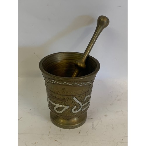 305 - Islamic Brass Pestle And Mortar. 10 x 11 cms