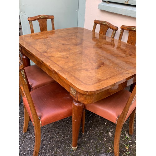 73 - French Walnut Veneer Art Deco Style Table And Six Chairs With Gilt Metal Adornments.