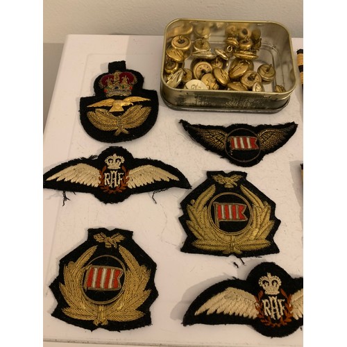 121 - A Collection Of Military Cloth Badges Predominately RAF Together With A Tin Of Military Buttons