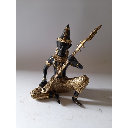 197 - Bronze Buddha playing a string instrument 14cm high