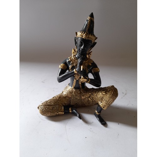 198 - Bronze Buddha playing a wind instrument 14cm high