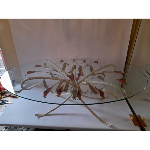 253 - Decorative metal and glass coffee table in the form of lillies. 180cm x 80cm x 46cm