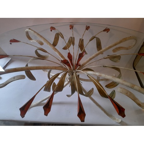 253 - Decorative metal and glass coffee table in the form of lillies. 180cm x 80cm x 46cm