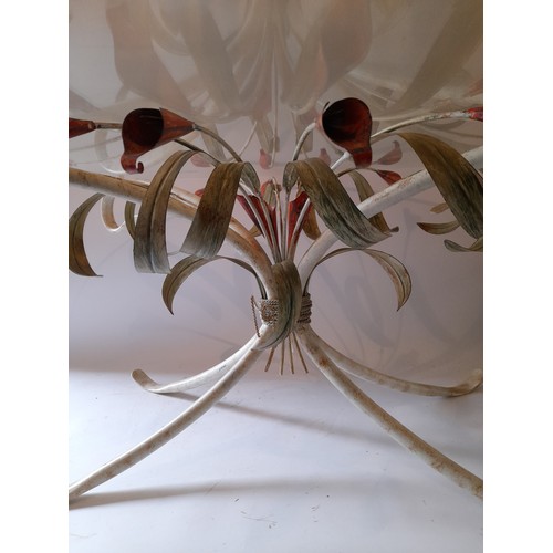 253 - Decorative metal and glass coffee table in the form of lillies. 180cm x 80cm x 46cm