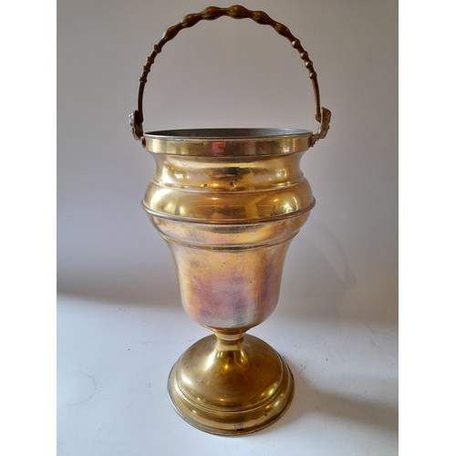 257 - Large brass plated urn with folding handle, marked to base. 40cm high x 22cm