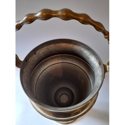 257 - Large brass plated urn with folding handle, marked to base. 40cm high x 22cm