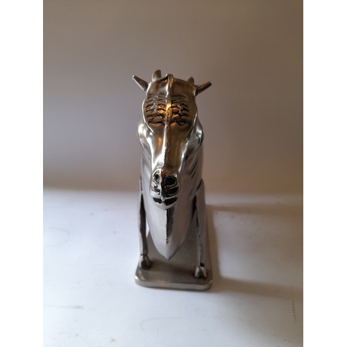 261 - Polished metal figure of a cow, 49cm x 27cm