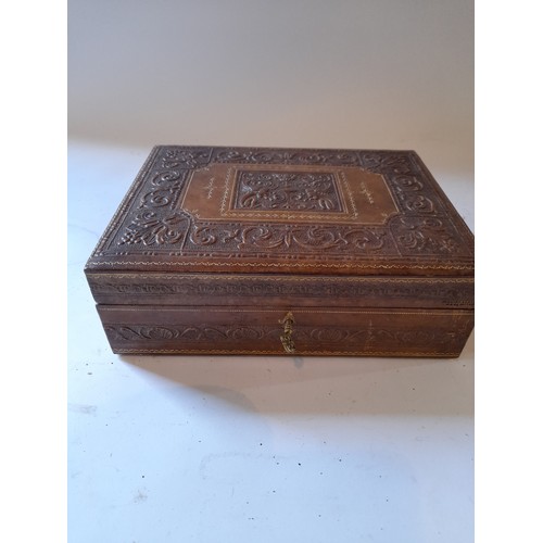 269 - wooden Jewelry box with embossed leather cover. 24cm X 19cm X 4cm