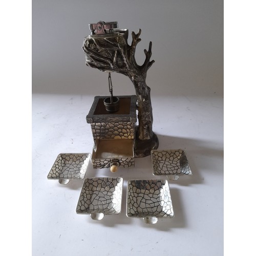 273 - Continental metal novelty table lighter in the form of a tree over a well with drawer under well con... 