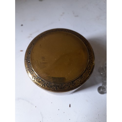 277 - 1 x round Brass box 8cm dia and a glass pin box with Brass lid 10cm long (2)