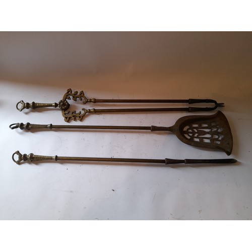 299 - Large fireside tools consisting of Tongs, Poker, and Shovel, 80bm long