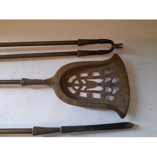 299 - Large fireside tools consisting of Tongs, Poker, and Shovel, 80bm long