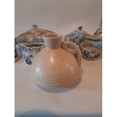 303 - A collection of ceramic items to include blue and white and a Crown Ducal Waxy Glaze jug number 259.