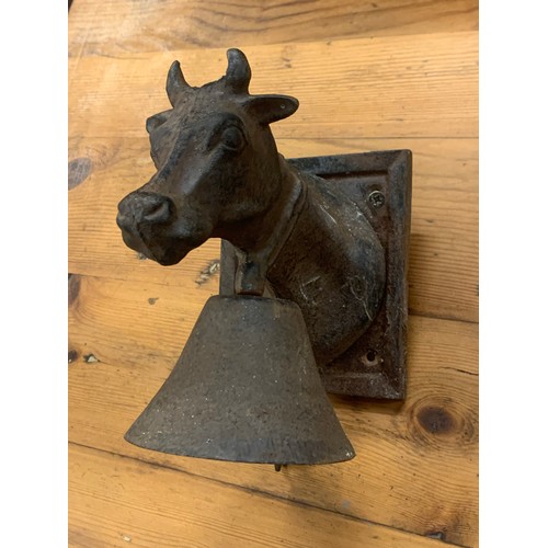 355 - Cast Metal Wall Mounting Bell In The Form Of A Cow .