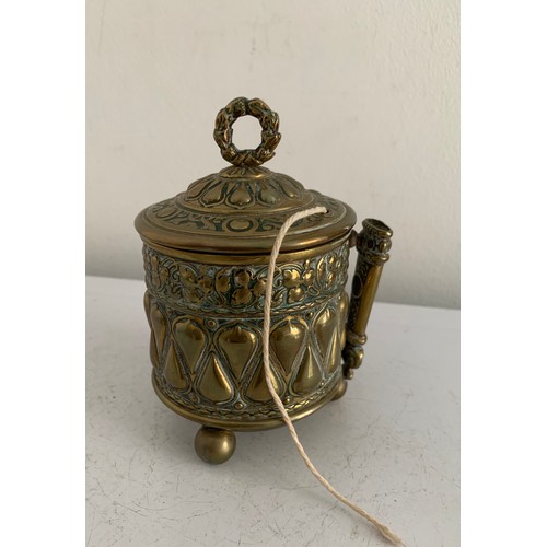 146 - 19thC Brass String Holder Having Relief Decoration And Reg no. 67233
8 cms diameter x 12 cms h