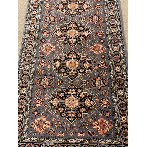 64 - Decorative Blue Ground Rug. 162 x 85 cms