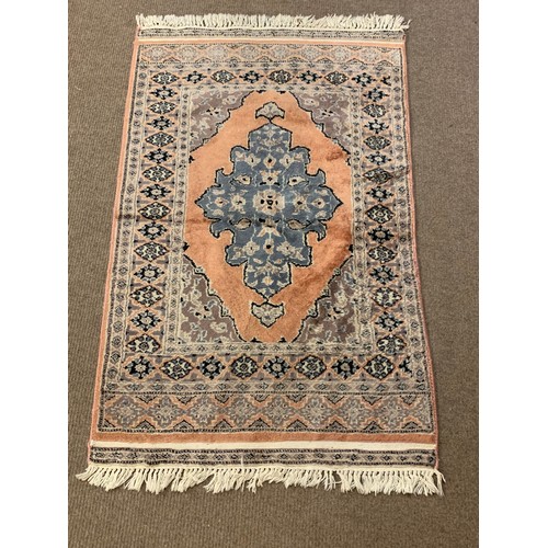 33 - Decorative Oriental Ground Rug. 127 x 77 cms