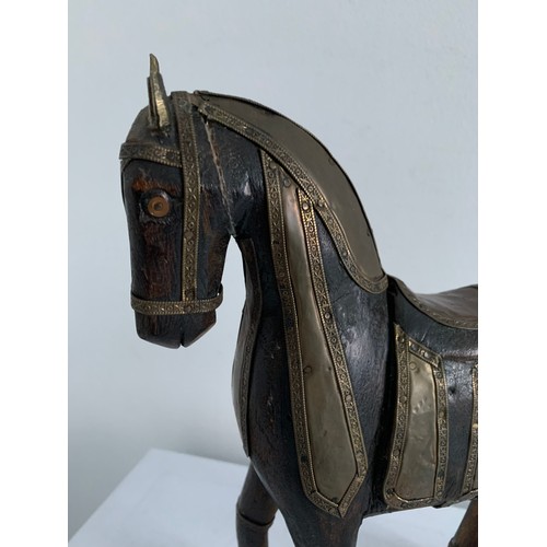 214 - Vintage Carved Wooden Statue Of A Horse Having Brass Copious Brass Adornments 
23 x 6 x 25 cms h