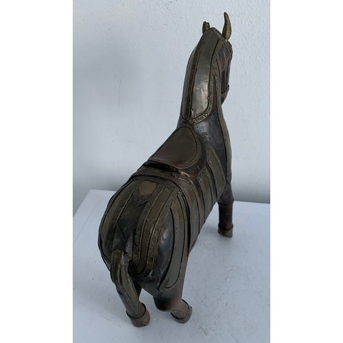 214 - Vintage Carved Wooden Statue Of A Horse Having Brass Copious Brass Adornments 
23 x 6 x 25 cms h