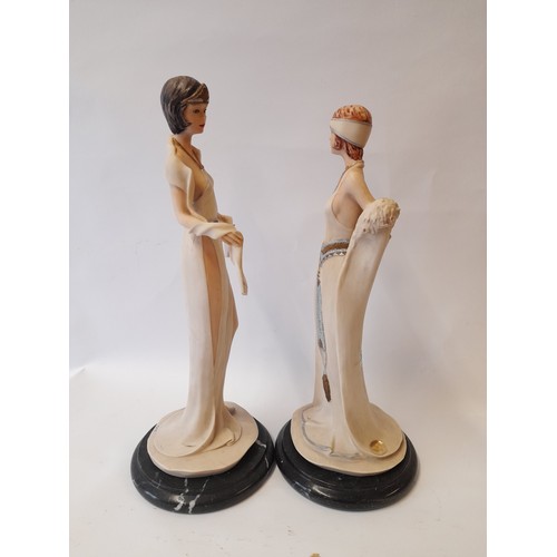 389 - Pai of Composite art deco style figures on marble base 37cm 
 and 34cm tall