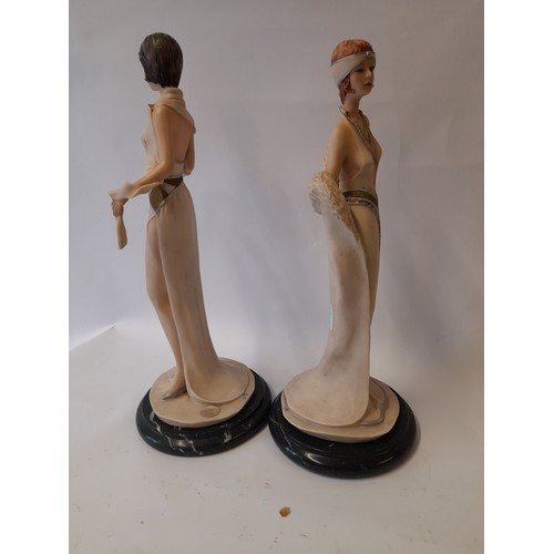 389 - Pai of Composite art deco style figures on marble base 37cm 
 and 34cm tall