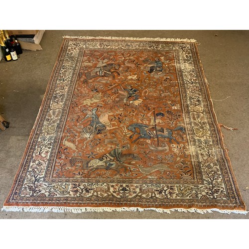 36 - Interesting ground rug with central hunting scenes from horse back 293cm 183cm