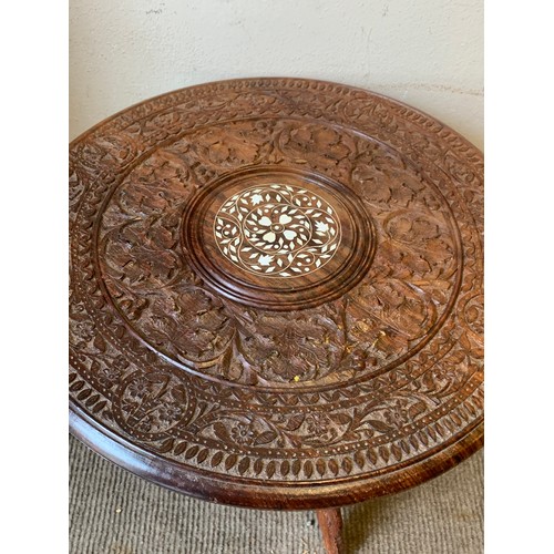 381 - Carved indian folding table 46cm dia x 46cm high