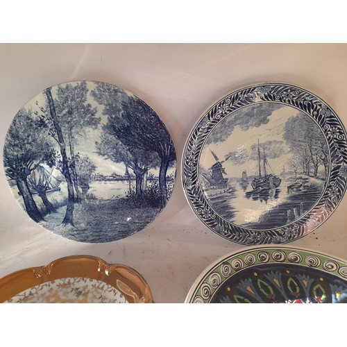 29 - 4 decoative plates to inclde 2 x blue and white Delft plates 28.5cm dia