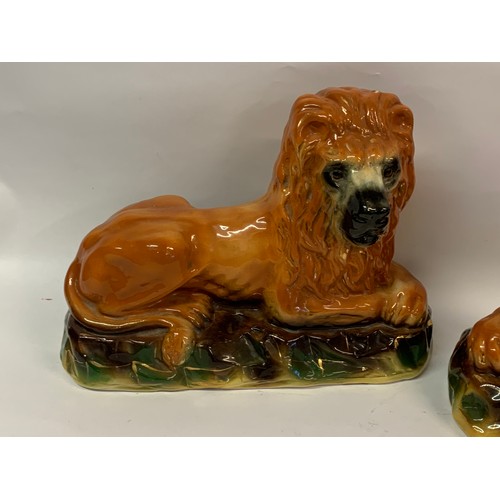 163 - A Pair Of Vintage Ceramic Lions. 35 x 26 cms (2)