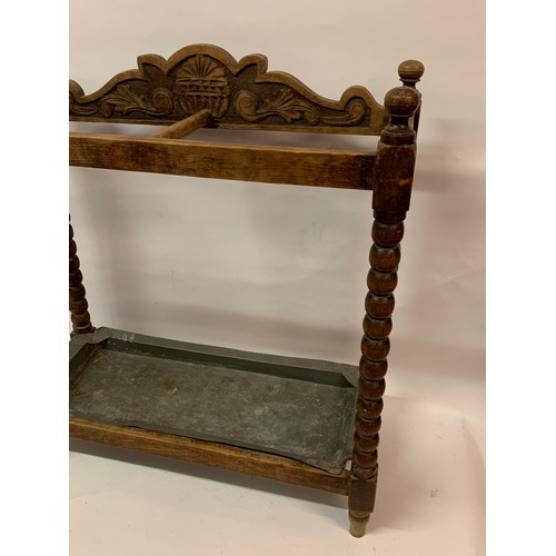 7 - Antique Umbrella Stand With Bobbin Legs And Drip Tray. 64 x 26 x 69 cms