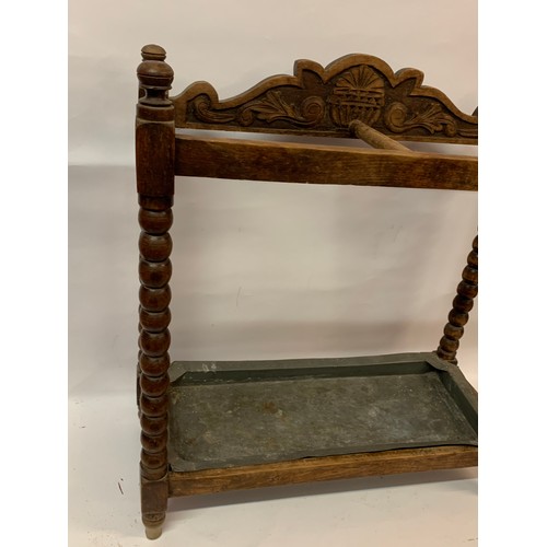 7 - Antique Umbrella Stand With Bobbin Legs And Drip Tray. 64 x 26 x 69 cms