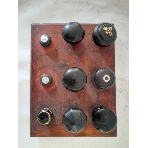 72 - Display of vintage door knobs mounted on wood 30cm x 23cm