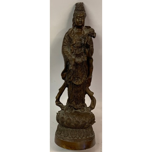 306 - Bronze Buddha Figure Standing On A Lotus Flower. 34 cms High