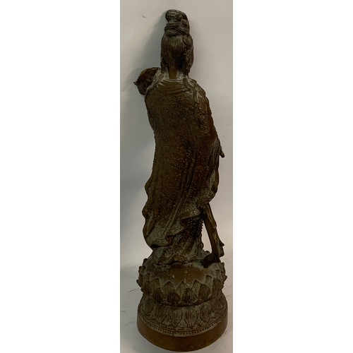 306 - Bronze Buddha Figure Standing On A Lotus Flower. 34 cms High