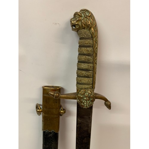 376 - Navel Dirk With Brass And Leather Scabbard Shagreen Grip With Lion Head Finial. 58 cms