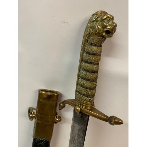 376 - Navel Dirk With Brass And Leather Scabbard Shagreen Grip With Lion Head Finial. 58 cms