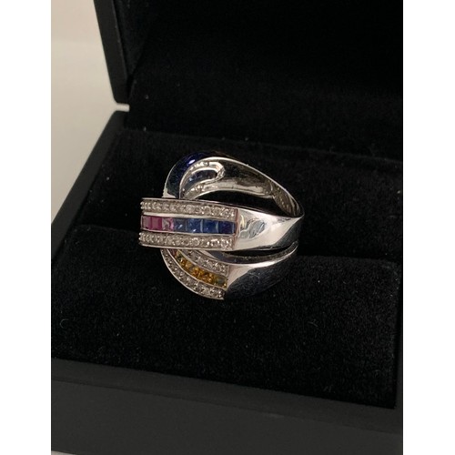 347 - Blue Pink Yellow Sapphires Set In Diamonds In 18ct White Gold Ring
10.2 g. Size N