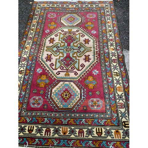 82 - Decorative Hand Made Rug With Central Pattern. 234 x 143 cms