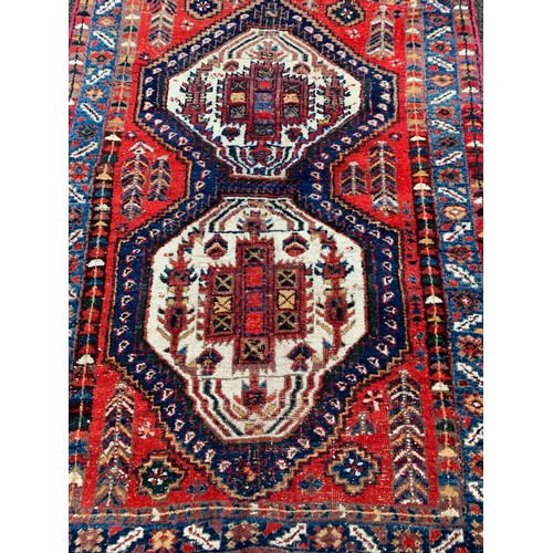 86 - Hand Made Ground Rug With Central Pattern 184 x 127 cms