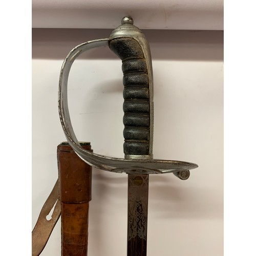 419 - Victorian Rifle Officers Sword In Leather Scabbard With A Good Clean Decorated Blade.