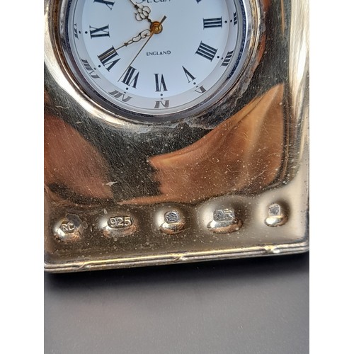 4 - Hallmarked silver framed clock marked R Carr England 9cm x 6cm