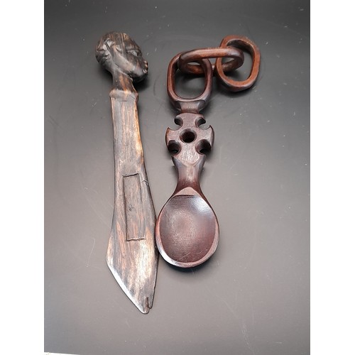 31 - 3 x Treen items to include long  3 x carved wood heads in cage from one piece of wood 47cm long alon... 