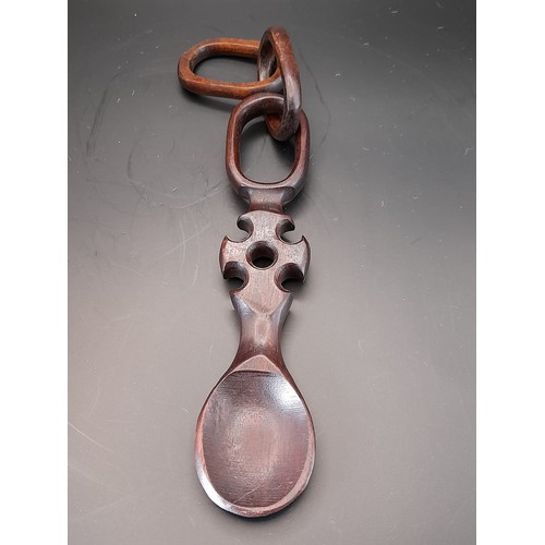 31 - 3 x Treen items to include long  3 x carved wood heads in cage from one piece of wood 47cm long alon... 